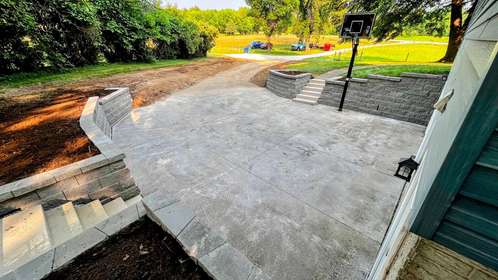 Concrete driveway with steps and basketball hoop Ankeny, IA