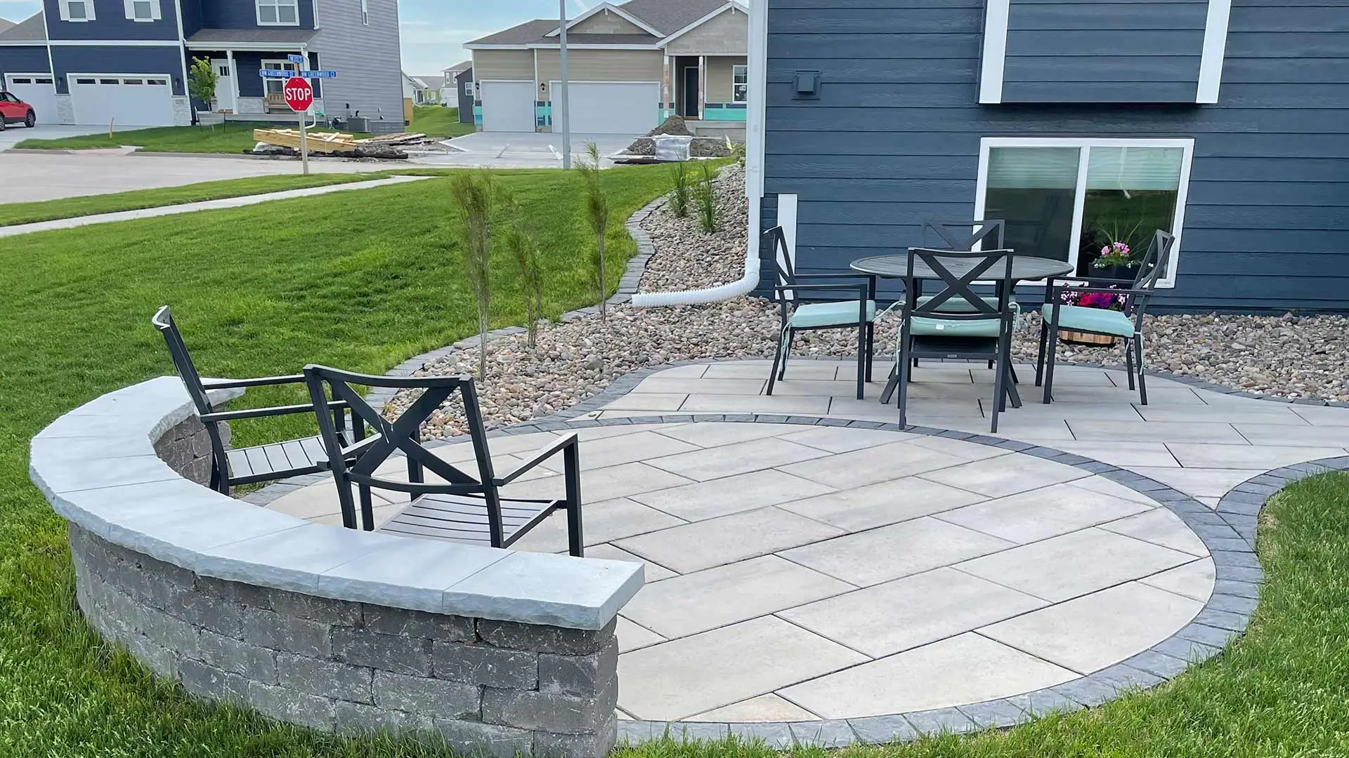 Custom patio installed with chairs set in Ankeny, IA.