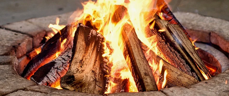 Burning wood on a fire pit in Ankeny, IA.