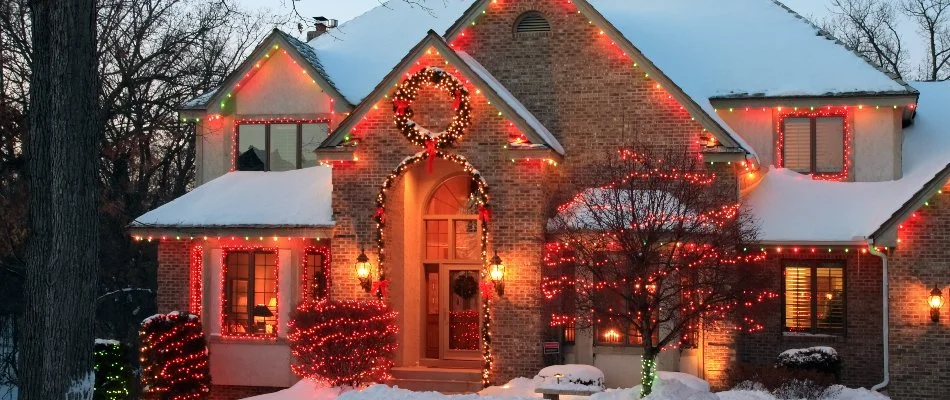 Custom-cut, colorful holiday lights on a house in Ankeny, IA.