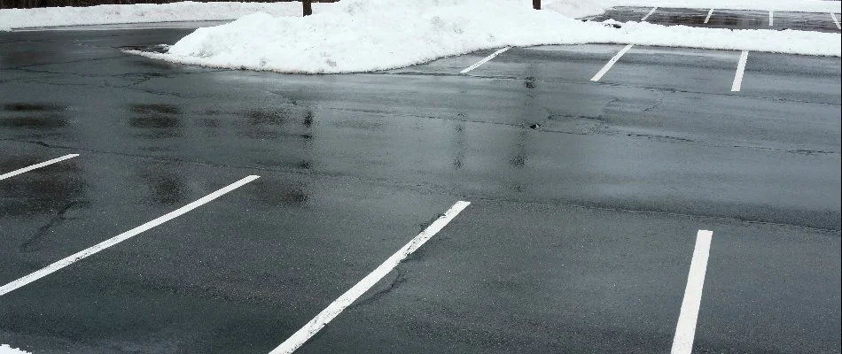 Parking lot of a commercial property in Ankeny, IA, after snow removal.