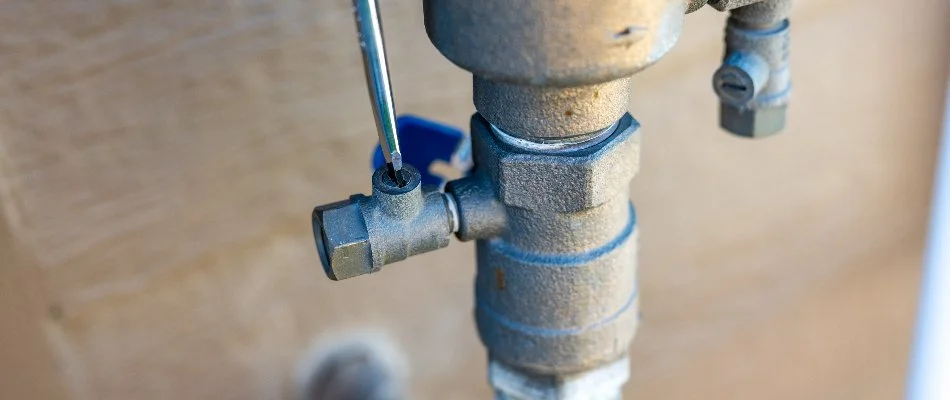 Turning on an irrigation system in Ankeny, IA, during an irrigation startup service.