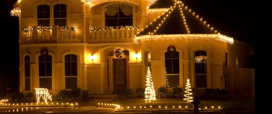 Warm white Christmas lights on a house in Ankeny, IA.