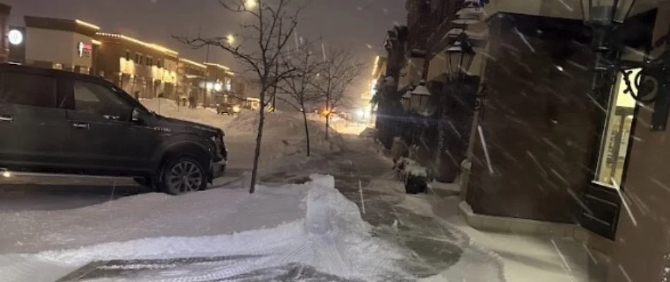 A walkway cleared of snow in front of a business in Iowa.