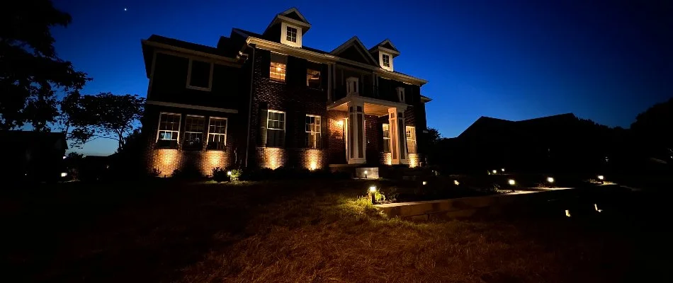 Landscape lighting for a house and front yard in Bondurant, IA.