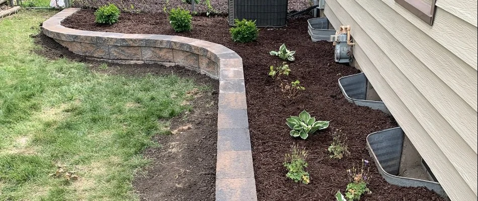 Raised planter bed along a house in Johnston, IA.