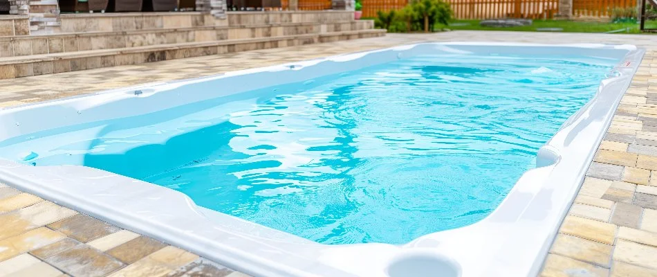 Fiberglass pool at a residential property in Ankeny, IA.