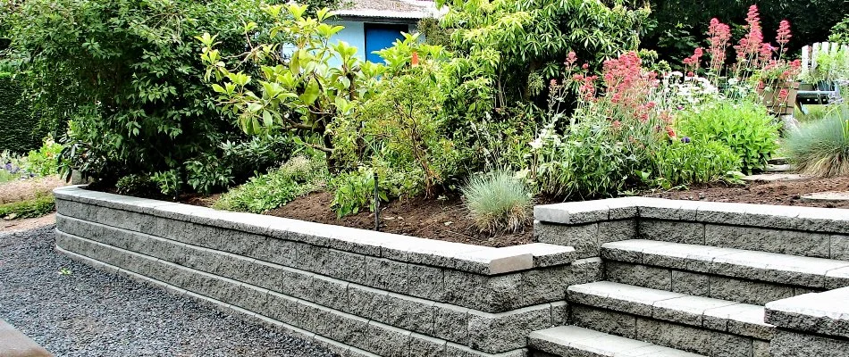 A retaining wall with a raised planter bed in Ankeny, IA.