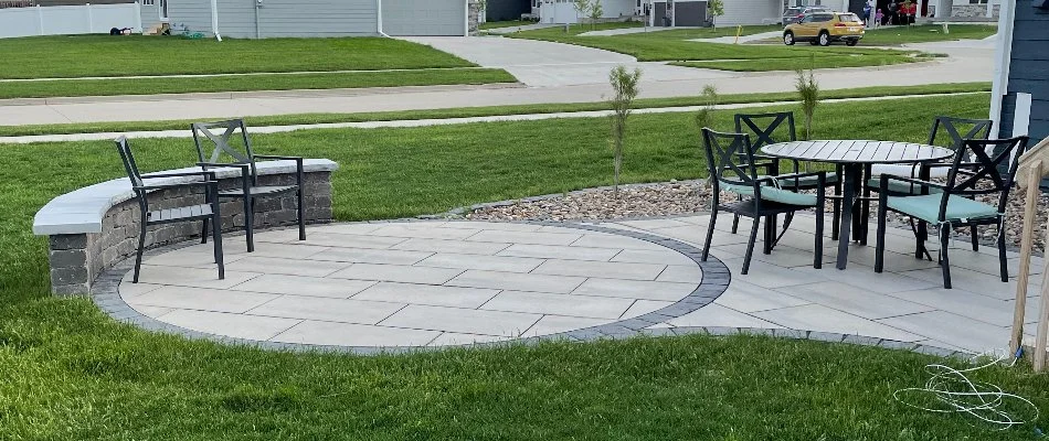 Small patio in Ankeny, IA, with a seating wall.